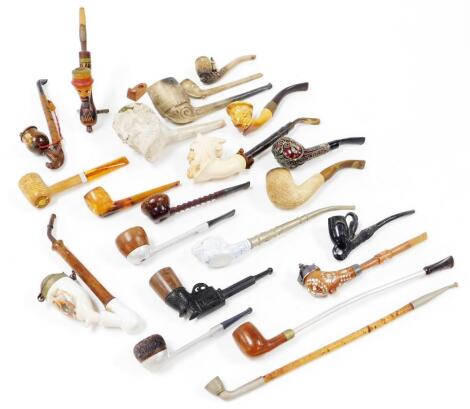 Various pipes, to include a porcelain transfer printed example with metal mounts and wooden stem, 22cm high, figure head examples, pistol lighters, various others. (a quantity)