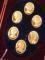 A set of six 22 carat gold cameo medallions in the form of Her Majesty Queen Elizabeth II