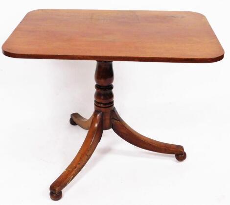 A 19thC mahogany tilt top occasional table, the oblong top raised on a baluster stem terminating in triple sabre legs with bun feet, when lowered 68cm high, 87cm wide, 63cm deep.