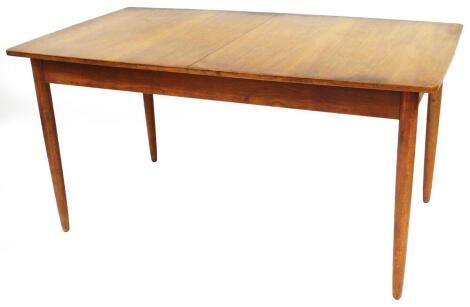 A 1960's teak extending dining table, numbered 141, when closed 73cm high, 148cm wide, 62cm deep.