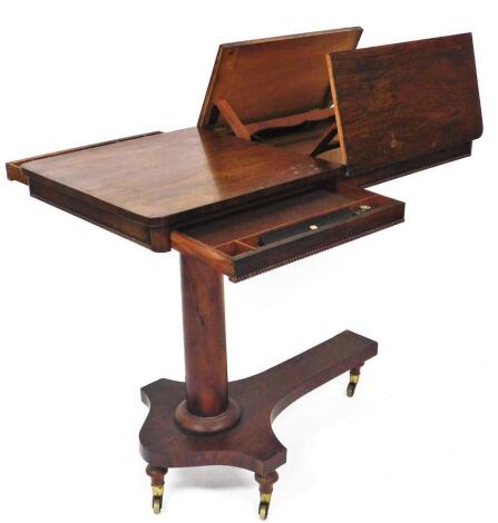 An early 19thC rosewood reading table, the oblong top with a bead outline with articulated adjustable double lecterns, on a cylindrical stem and cross platform base, terminating in castors (when closed) 75cm high, 92cm wide, 53cm deep.
