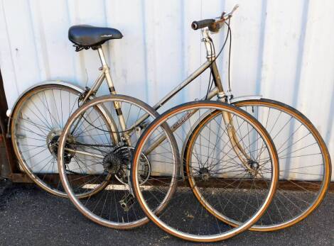 A Raleigh Medale ladies bicycle, with later Geltech seat, 110cm high and extra wheels.