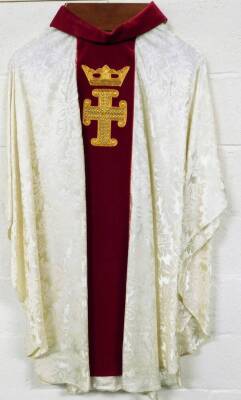 An ecclesiastical vestment robe, with crown and cross motif on a red ground, with white body, 133cm high, size unknown.