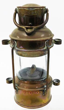 A paraffin miner's type lamp, with applied anchor scroll badge, 26cm high. N.B. This lot is sold on behalf of the Rotary Club of Grantham.