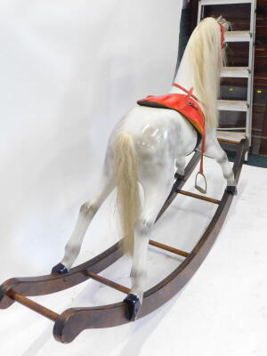 A dapple grey rocking horse, on shaped rocker, brass plaque for Made by John Marriott, Bromham, Bedford, with leather saddle, horse hair etc. 183cm wide. - 3