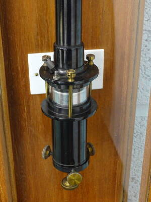 A black and brass and steel ship's barometer, signed Scientific and Projections Limited, London, EC1 in a fitted and glazed teak case 126cm high overall. - 2