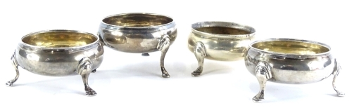 Four 19thC silver salts, each of circular form on cabriole legs with moulded feet, various dates, some marks indistinct, 5oz overall.