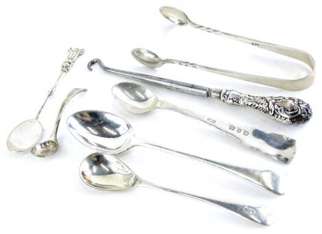 A collection of small silver spoons, sugar tongs, etc., various types, dates, etc., 1½ oz.