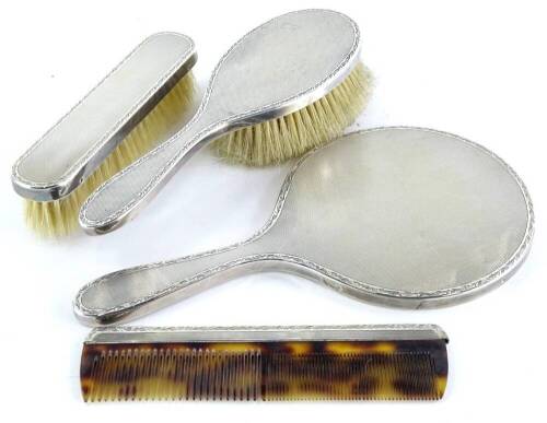 A silver mounted four piece dressing table set, engraved to the larger brush Dearest Pegs, My Fondest Love Always John, 24th July 1972, London 1972.