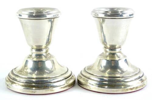 A pair of Elizabeth II silver dwarf candlesticks, each of plain form, with a weighted base, Birmingham 1971, 6cm high.