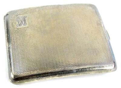 A George VI silver cigarette case, with engraved decorations and monogram, Birmingham 1951, 4½oz.