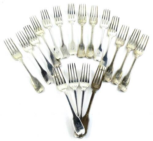 An associated set of 19thC silver fiddle pattern dessert forks, each with an engraved handle, 25¾ oz.