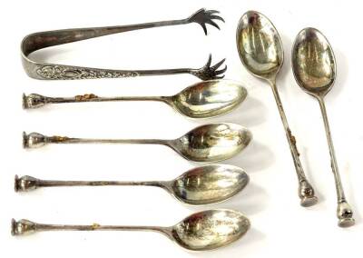 A collection of six George V seal top silver teaspoons, Sheffield 1930, 2¾oz and a pair of silver plated sugar tongs.