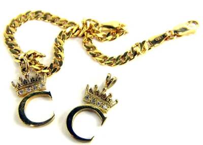 A 9ct gold bracelet and pendant set, the bracelet with curb links and initial C with crown and tiny white stones, with matching pendant, 7g all in.