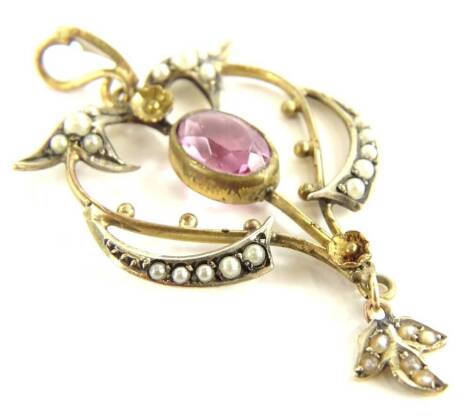 A silver gilt Art Nouveau pendant, set with faux pearl and pink paste stone, in rub over setting, (AF), 4.5cm high.