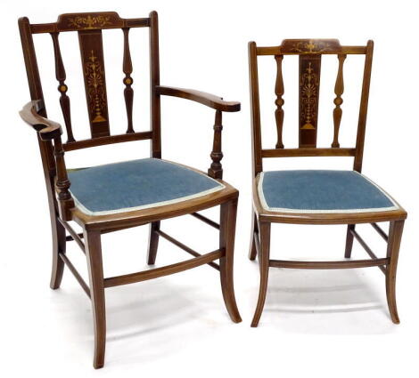 An Edwardian mahogany and marquetry open armchair, with a blue padded seat on shaped legs, and a matching nursing chair. (2)