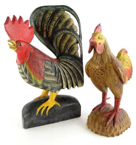 A later 20th/early 21stC carved wooden cockerel, and a similar chicken, the cockerel, 53cm high.