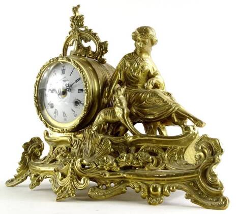 A continental brass figural mantel clock, the dial with Roman numerals, 38cm wide.