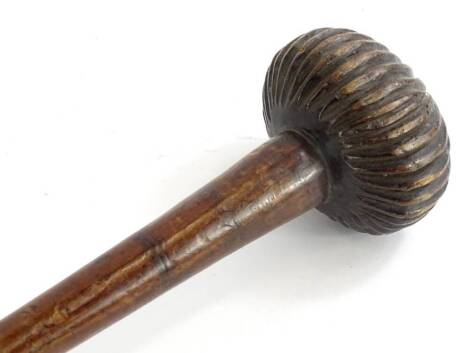 An African tribal knobkerrie, with ribbed end of tapering form, 72cm long.