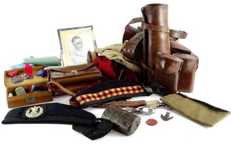 Miscellaneous militaria and Masonic items relating to members of the Fenton family, to include Cameron Highlanders cap, military cutlery, leather dog tags relating to a F. Fenton, a military belt with holster attachment, Masonic aprons and bags relating t