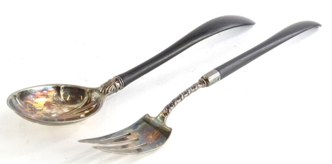 A pair of Gorham American silver plated salad servers, each with an ebonised handle, stamped Gorham, 48cm long.