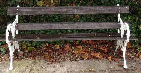 A cast iron slatted garden bench, decorated with berries and leaves, 189cm long.