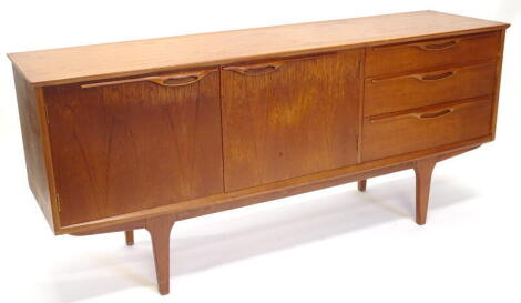 A 1970s/80s vintage teak sideboard, with two doors and three drawers on square tapering legs, 170cm wide.