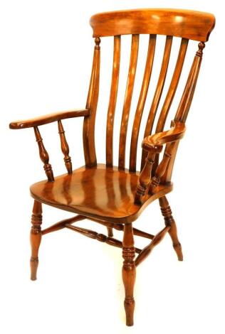 A 19thC lath back beech and elm open armchair, on turned tapering legs with H stretcher, stamped to the reverse GW.