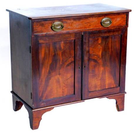 An early 20thC mahogany side cabinet, the top with rounded corners above a frieze drawer, and two panelled doors on bracket feet, 77cm high, 77cm wide.