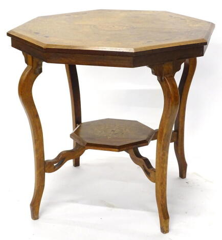 A late 19thC/ early 20thC walnut window table, the octagonal top with marquetry decoration of leaves, flowers, around a central roundel, on splayed legs with undertier, 76cm wide.