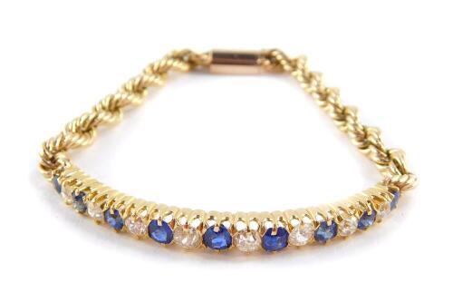 A Victorian sapphire and rose cut diamond set bracelet, claw mounted, with a later rope twist bracelet, on a snap clasp, comprising nine graduated sapphires and eight graduated diamonds, diamonds approx 1 carat, 18.2g.