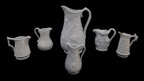 Six Portmeirion Heritage Collection parian relief moulded jugs, printed and raised marks, 9-, 22cm high.