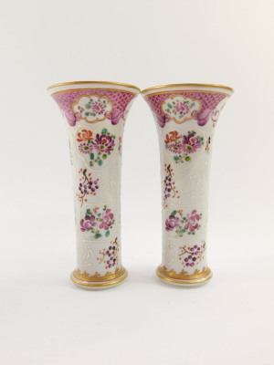 A Samson late 19thC porcelain garniture of vases, decorated in the Chinese export style with armorials and flowers against a scale famille rose ground, comprising a baluster shaped vase and cover, 17.5cm high, and a pair of trumpet shape vases, 15.5cm hig - 2