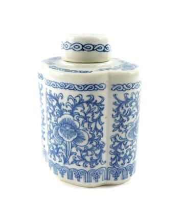 A Chinese blue and white porcelain tea canister and cover, of lobed form, decorated with flowers and scrolling leaves, bears six character mark, 16.5cm high.