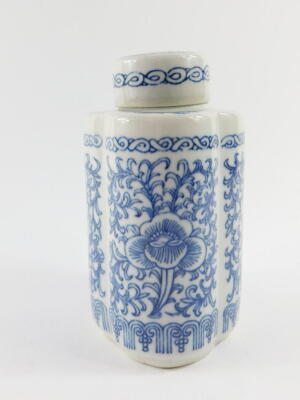 A Chinese blue and white porcelain tea canister and cover, of lobed form, decorated with flowers and scrolling leaves, bears six character mark, 16.5cm high. - 2