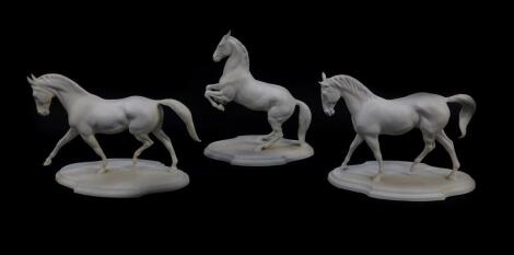 Three Franklin Mint Parian figures of horses, designed by Pamela du Boulay, comprising Extended Trot, Levade, and Travers.