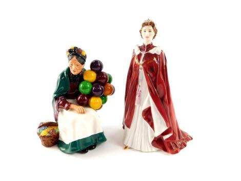 A Royal Doulton figure modelled as The Old Balloon Seller HN1315, together with a Royal Worcester porcelain figure of Her Majesty The Queen, in celebration of The Queens 80th Birthday 2006, dressed in the robes of the Order of the British Empire. (2)