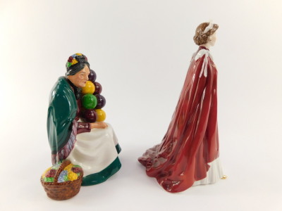 A Royal Doulton figure modelled as The Old Balloon Seller HN1315, together with a Royal Worcester porcelain figure of Her Majesty The Queen, in celebration of The Queens 80th Birthday 2006, dressed in the robes of the Order of the British Empire. (2) - 2