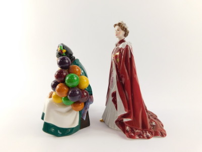 A Royal Doulton figure modelled as The Old Balloon Seller HN1315, together with a Royal Worcester porcelain figure of Her Majesty The Queen, in celebration of The Queens 80th Birthday 2006, dressed in the robes of the Order of the British Empire. (2) - 4