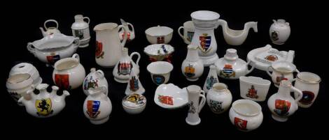 Goss and Crested china, including the old horse shoe, arms of Blandford Forum, lobster trap Arms of Jersey, two shell shaped dished Arms of Colchester and Wolverton, ancient jar found in the abbey ruins at Wymondham, ancient arms of Bedford and an abbot's