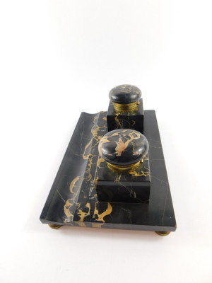 A French late 19thC veined black marble desk stand, with a pair of square integral inkwells with hinged gilt metal mounted lids, raised on a rectangular base with pen recess, on brass feet, 28cm wide, 17.5cm deep. - 3