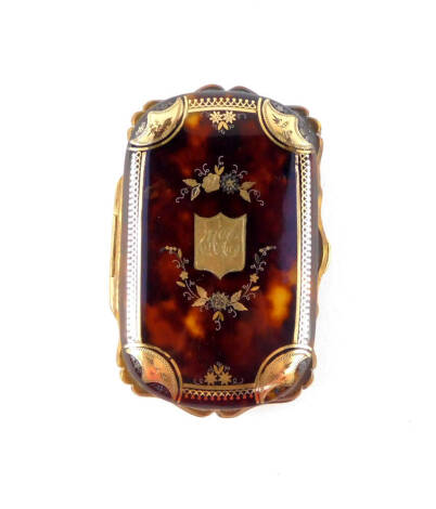 A Victorian tortoiseshell purse, with gold and silver pique decoration, decorated centrally with a monogrammed shield in a surround of flowers, 8.5cm wide.