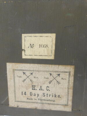 A German late 19thC oak and mahogany cased mantel clock, by the Hamburg American Clock Company, circular brass dial with enamelled chapter ring bearing Roman numerals, eight day movement with coil strike, the case of architectural form, no. 1068, with key - 4