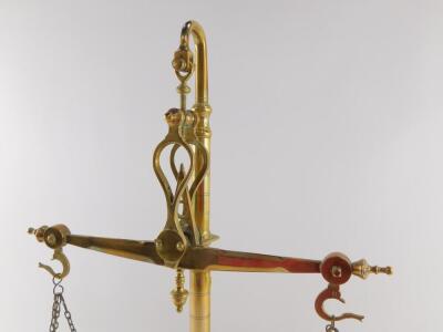 A set of brass balance scales, with weights, in an integral base, 55cm high. - 3