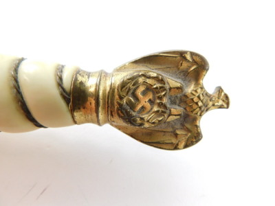 A Third Reich Kriegsmarine dagger, with gilt wire bound ivory grip, topped by a Swastika pommel, and etched steel blade, by Eickhorn, Solingen, 38cm wide. (AF) - 8