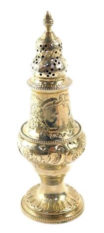 A George III silver sugar caster, of baluster form, embossed and engraved with flowers and rococo scrolls, shield reserves, Thomas Daniel and John Wall, London 1781, 2.94oz.