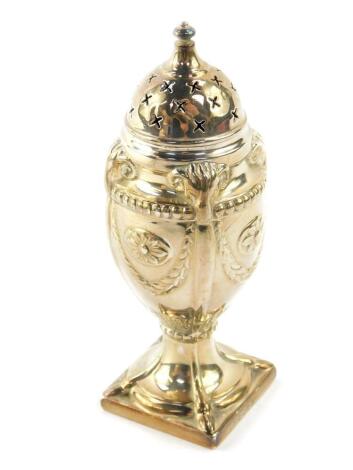 A Victorian silver sugar caster of neo classical form, embossed with ram's heads, wreaths and acanthus leaves, Hawsworth Eyer and Company Limited, London 1887, 2.11oz.