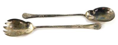 A pair of Edward VII silver salad servers, with embossed shell and scrolling leaf decoration, Walker and Hall, Sheffield 1905, 5.84oz.