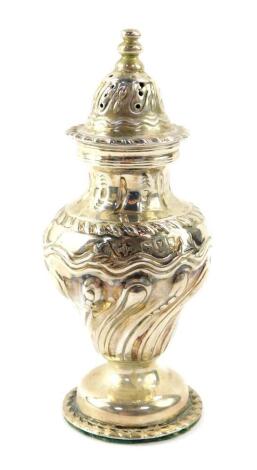 A Victorian loaded silver sugar caster, of semi fluted baluster form, William Hutton and Sons Limited, London 1895, 3.90oz all in.