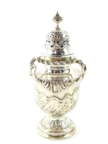 A Victorian silver sugar caster, of baluster form, with embossed foliate decoration, William Comyns and Sons Limited, London 1895, 7.46oz.